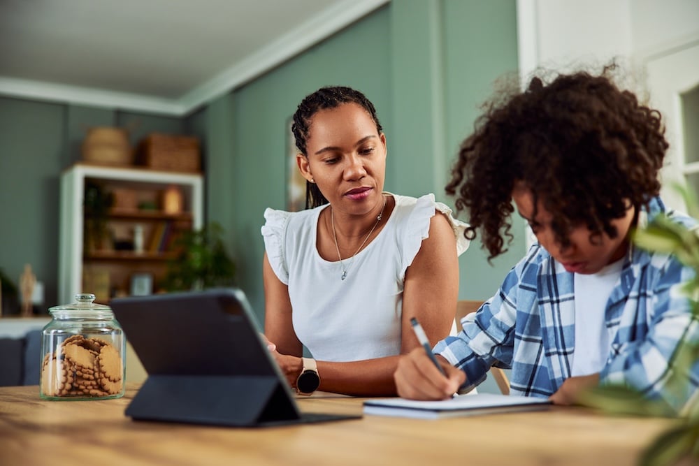 A parent and child do homework together