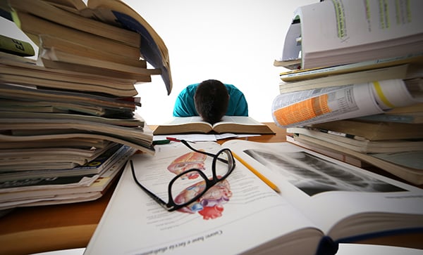 Student-is-stressed-during-study-with-head-on-desk