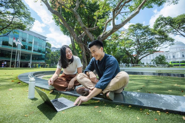 smu-students-discussing-campus-green-lkcsb-2021-1
