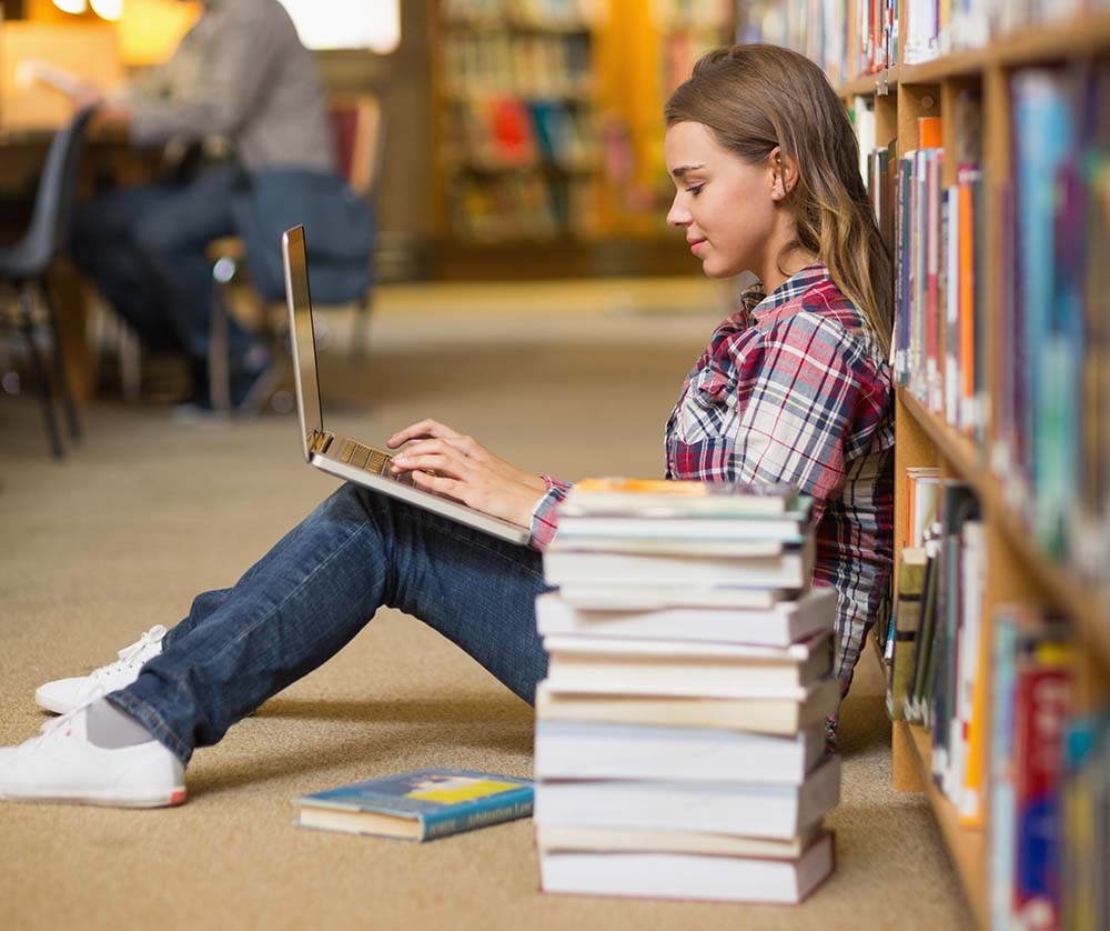 Girl_on_laptop_in_library